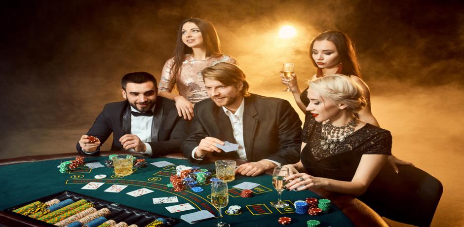 Group of men and women playing poker at the casino