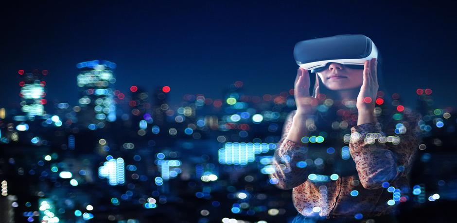 Woman wearing virtual reality goggles, looking at a city skyline at night