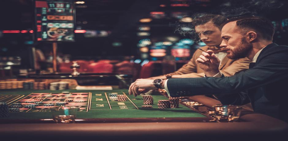 Two man playing poker at the casino