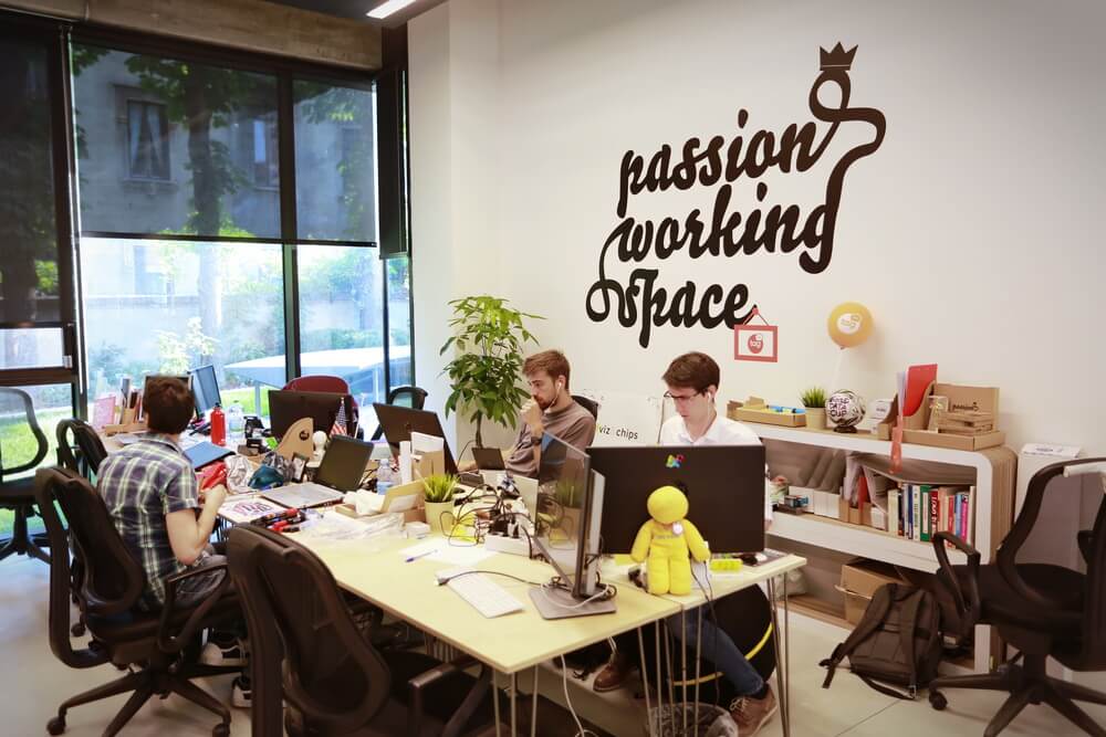 People gathered around a table in a co-working space