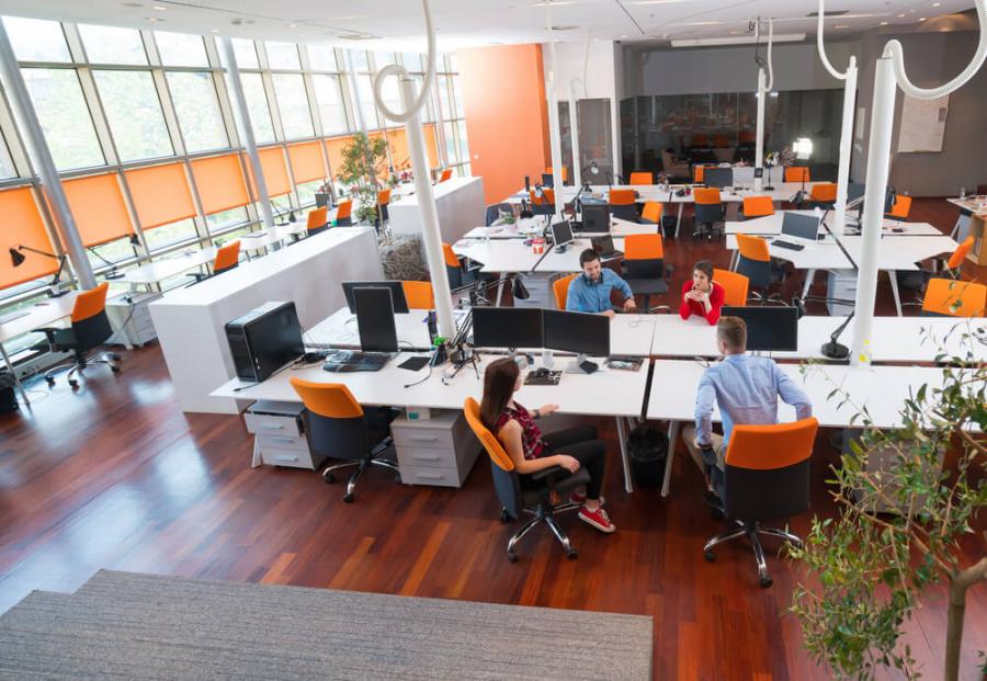 Spacious co-working space with orange chairs