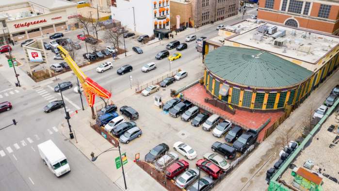 CHICAGO, IL, USA - MARCH 2, 2020: A drone / aerial view of the Hard Rock Cafe in downtown Chicago with cars driving by and a Walgreens store in the background.