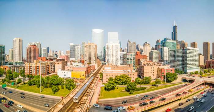 moving to Chicago? Downtown cityscape with elevated train and traffic. Panorama. West Loop, Chicago, USA. Interstate 90 at Lake Street.