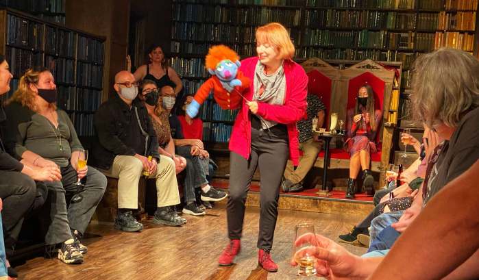 Drunk Shakespeare Chicago Review: actor on the stage with puppet in hand